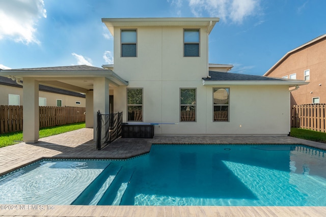 view of swimming pool with a patio area