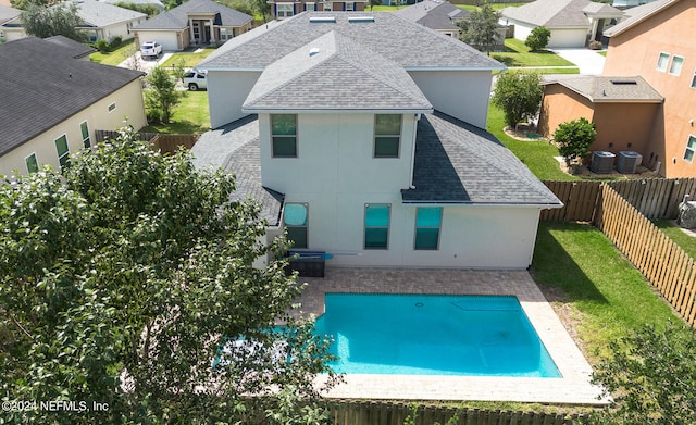 view of pool with a patio and central AC