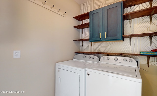 washroom featuring independent washer and dryer and cabinets