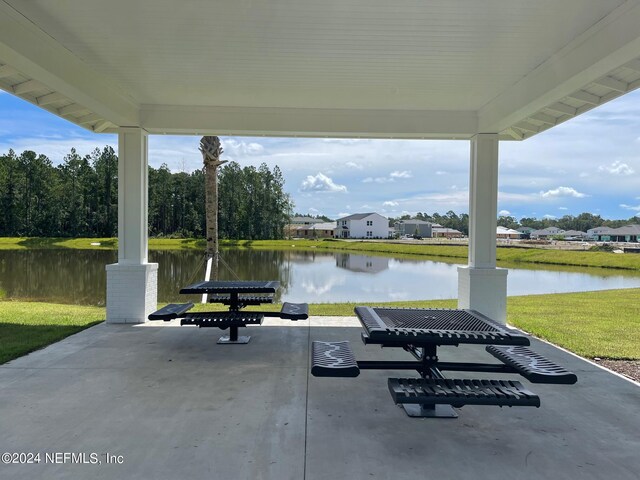 view of patio featuring a water view