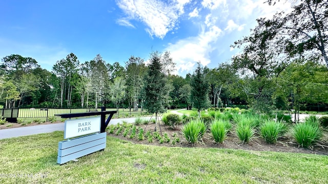 view of home's community with a yard