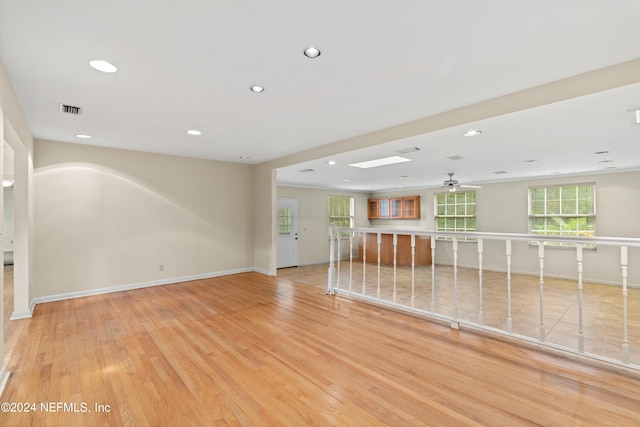 spare room featuring ceiling fan and light wood-type flooring