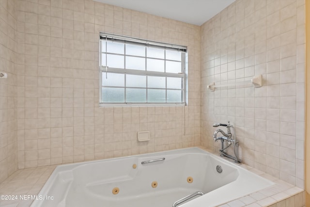 bathroom with tiled tub