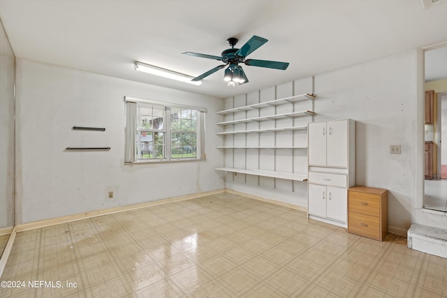 interior space featuring ceiling fan