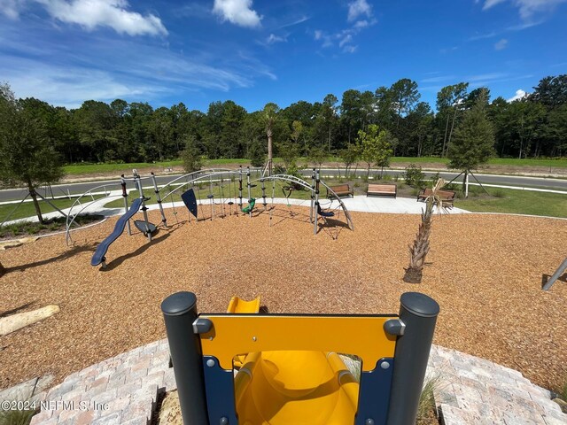 view of home's community with a playground