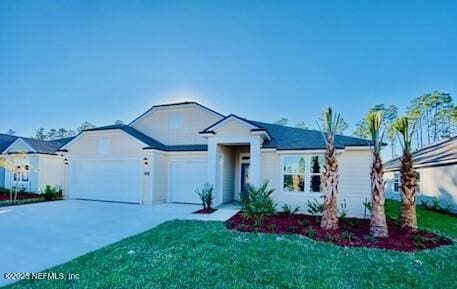 ranch-style home featuring a garage and a front lawn