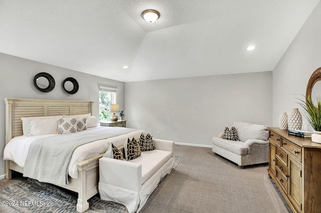 carpeted bedroom featuring vaulted ceiling