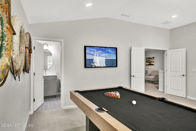 recreation room with light carpet, lofted ceiling, and billiards