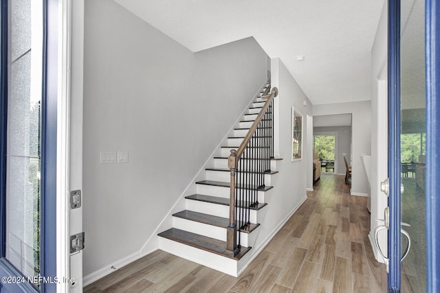 foyer entrance with hardwood / wood-style floors