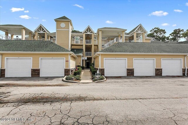 view of property with a balcony