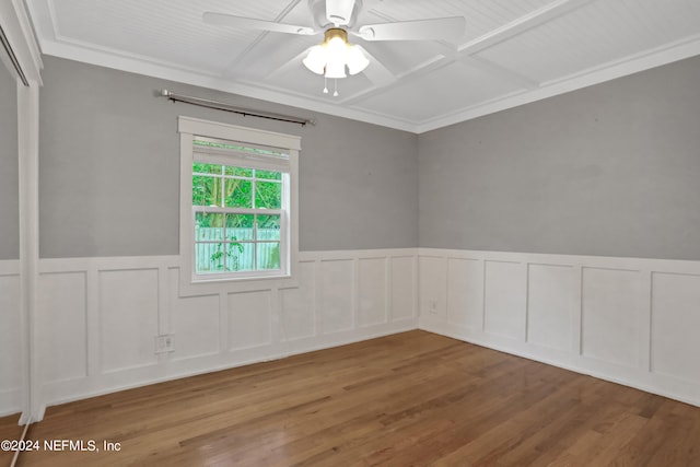 spare room with ceiling fan, hardwood / wood-style floors, and crown molding