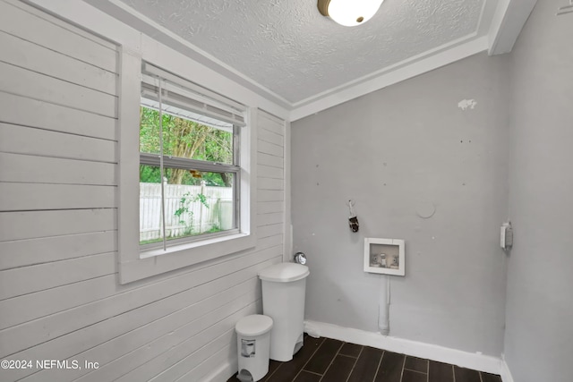 bathroom with lofted ceiling, wood walls, a textured ceiling, and toilet