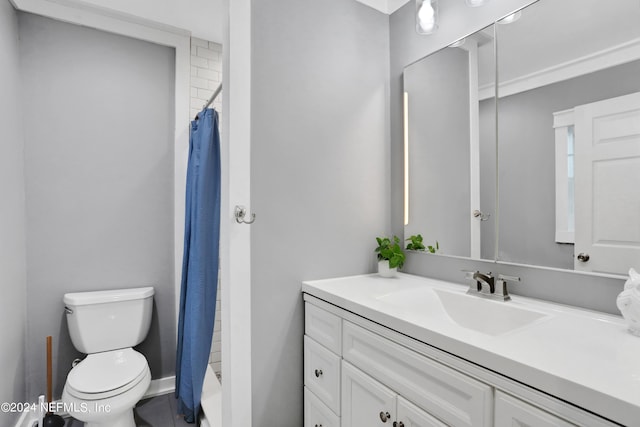 full bathroom with shower / tub combo, vanity, and toilet