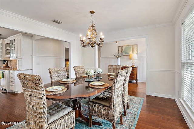 dining room featuring ornamental molding, dark hardwood / wood-style flooring, and plenty of natural light