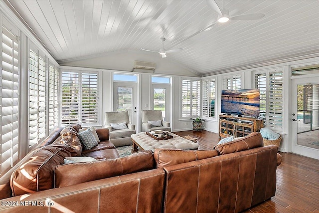 living room featuring a wealth of natural light, vaulted ceiling, and hardwood / wood-style flooring