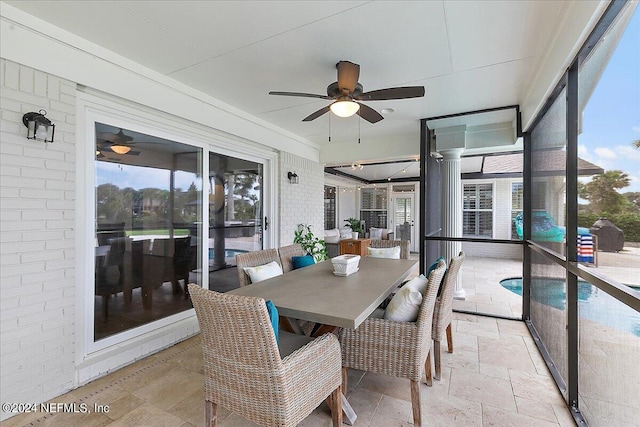 sunroom / solarium with ceiling fan