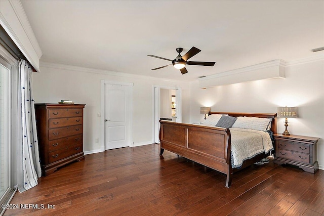 bedroom featuring ceiling fan, ornamental molding, and dark wood-type flooring