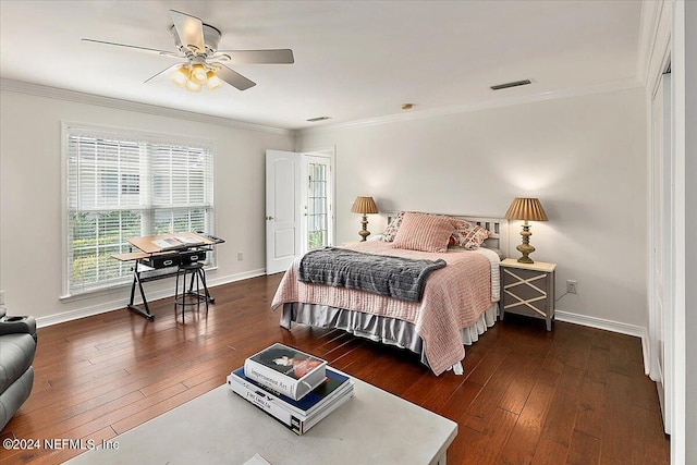 bedroom featuring ornamental molding, ceiling fan, and dark hardwood / wood-style flooring