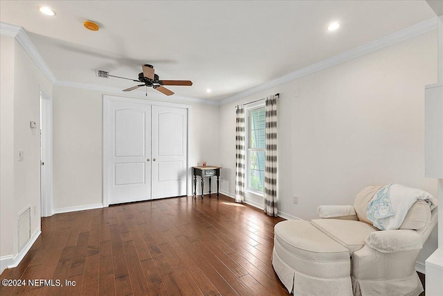 unfurnished room featuring crown molding, dark hardwood / wood-style floors, and ceiling fan