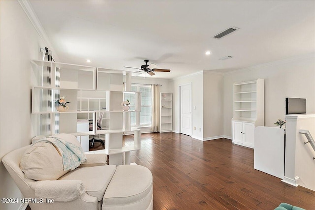 living room featuring ornamental molding, ceiling fan, and dark wood-type flooring