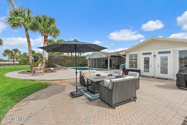 view of patio / terrace featuring french doors and a fenced in pool