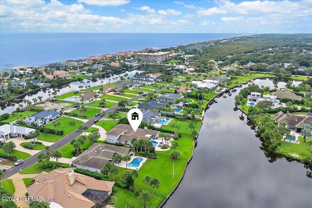 bird's eye view with a water view