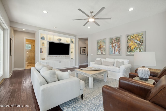 living room with ceiling fan and hardwood / wood-style flooring