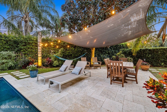 view of patio terrace at dusk