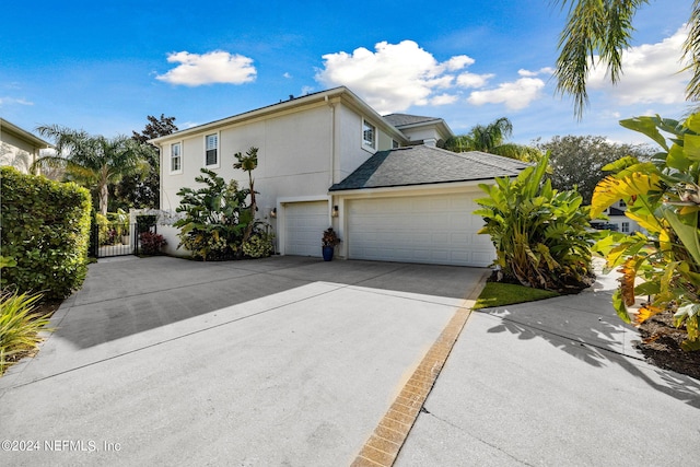 view of side of property with a garage