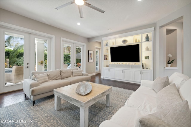 living room featuring french doors, dark hardwood / wood-style floors, a healthy amount of sunlight, and ceiling fan