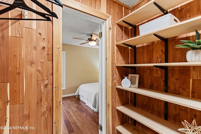 bedroom featuring a textured ceiling and hardwood / wood-style flooring