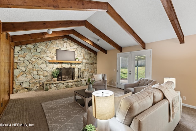 carpeted living room featuring lofted ceiling with beams, a fireplace, and french doors