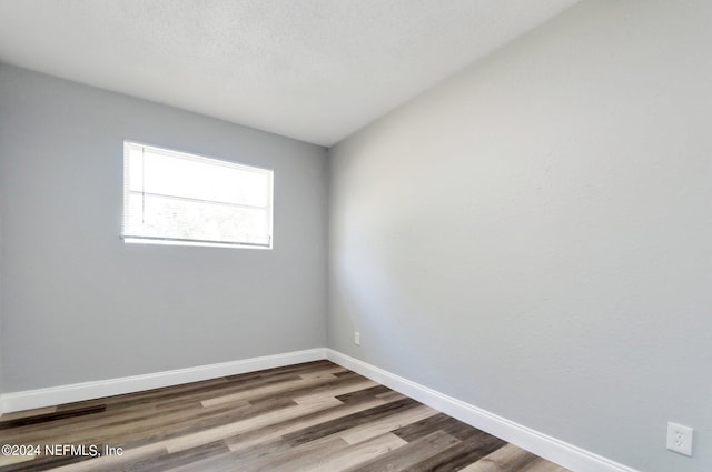 empty room featuring hardwood / wood-style floors