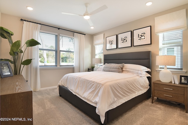 carpeted bedroom with ceiling fan