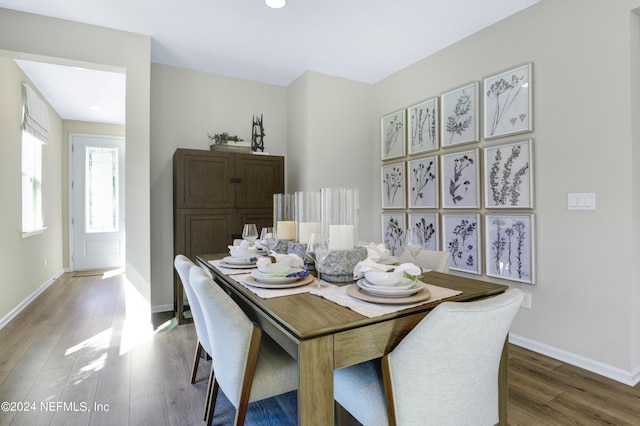 dining space featuring dark wood-type flooring