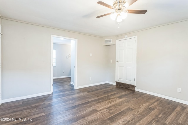 unfurnished room featuring ceiling fan and dark hardwood / wood-style floors