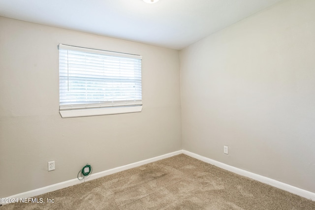 spare room featuring carpet flooring