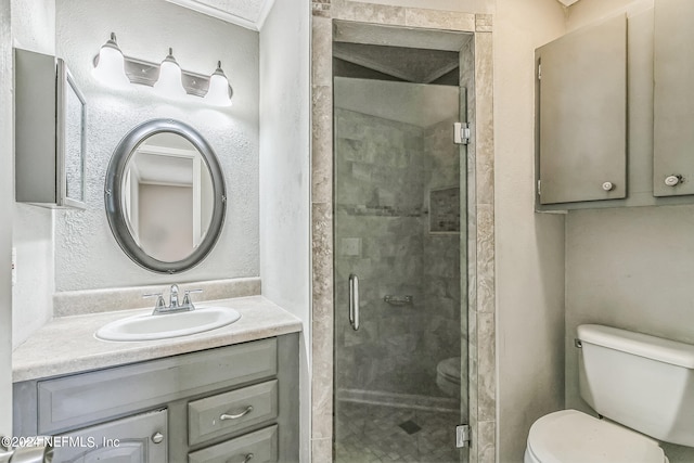 bathroom with walk in shower, vanity, and toilet