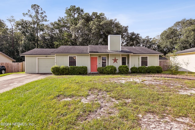 ranch-style home with a front yard and a garage