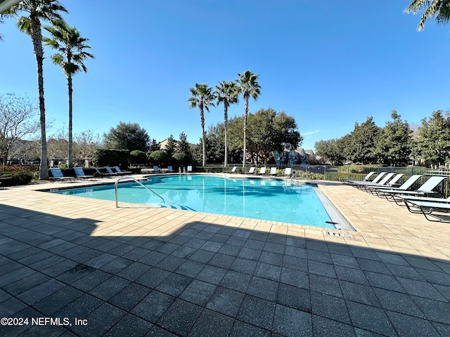 view of swimming pool with a patio