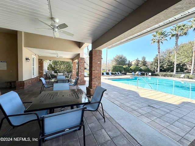 view of pool with ceiling fan and a patio