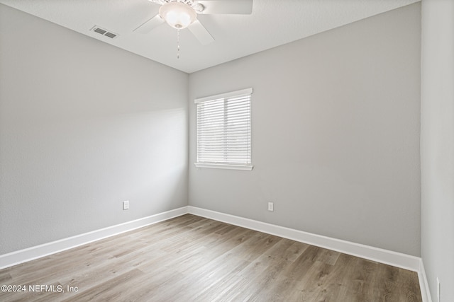 unfurnished room with ceiling fan and light hardwood / wood-style flooring