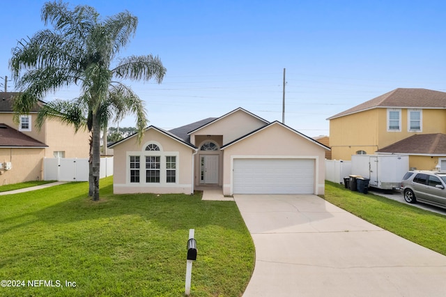 view of front of house with a front lawn and a garage