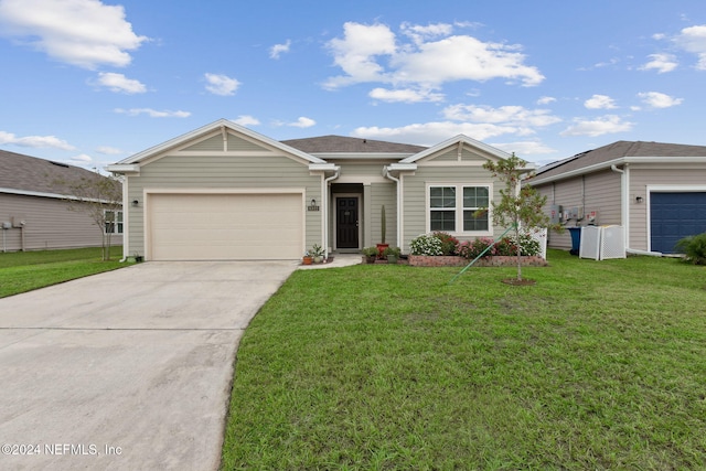 ranch-style home featuring a front yard and a garage