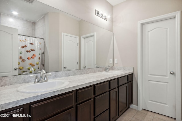 bathroom featuring vanity, a shower with curtain, and tile patterned floors