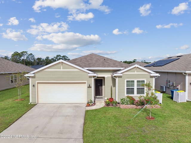 single story home with a garage and a front lawn