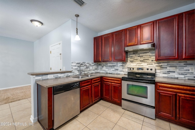 kitchen featuring light tile patterned floors, sink, pendant lighting, and stainless steel appliances