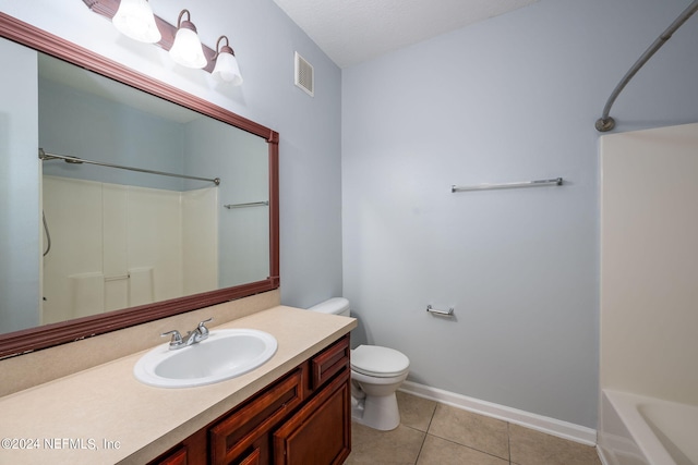 full bathroom featuring tile patterned floors, shower / bath combination, vanity, and toilet