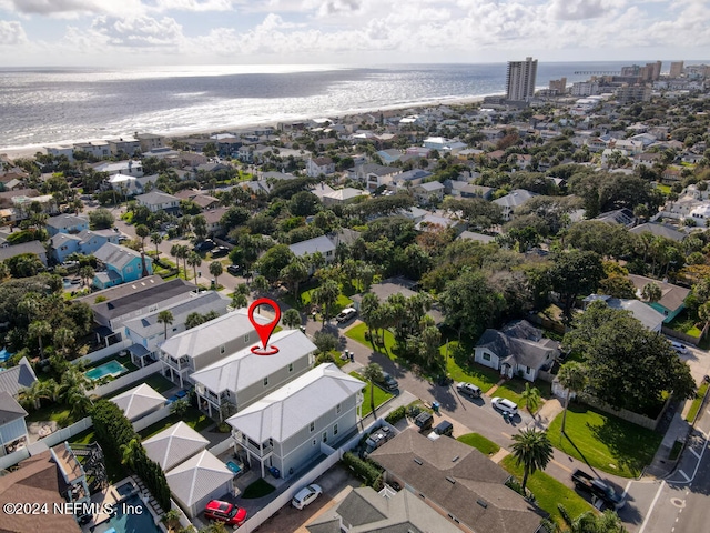 drone / aerial view featuring a view of the beach and a water view