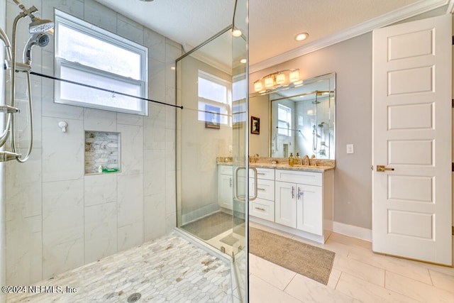 bathroom with a textured ceiling, a shower with shower door, vanity, and crown molding